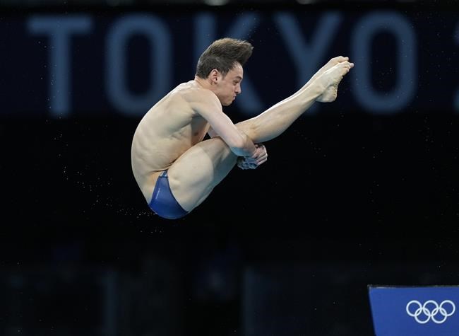 Thomas Daley of Great Britain competes in men's diving 10m platform semifinal at the Tokyo Aquatics Centre at the 2020 Summer Olympics, Saturday, Aug. 7, 2021, in Tokyo, Japan. (AP Photo/Dmitri Lovetsky)