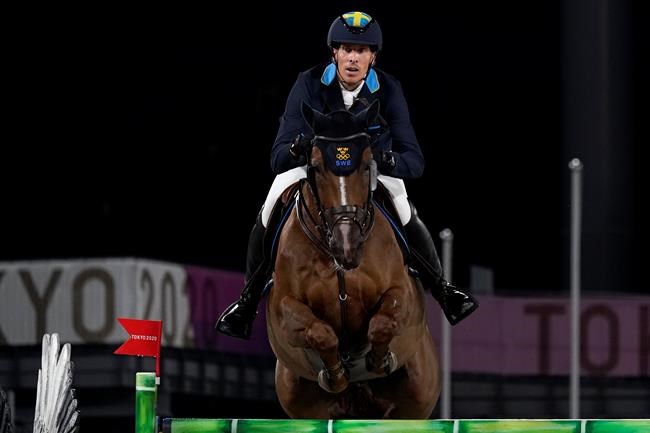 Sweden's Henrik von Eckermann, riding King Edward, competes during the equestrian jumping team final at Equestrian Park in Tokyo at the 2020 Summer Olympics, Saturday, Aug. 7, 2021, in Tokyo, Japan. (AP Photo/Carolyn Kaster)