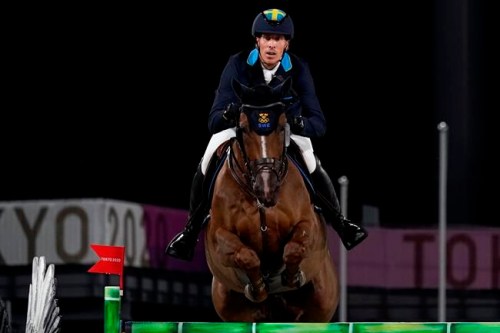 Sweden's Henrik von Eckermann, riding King Edward, competes during the equestrian jumping team final at Equestrian Park in Tokyo at the 2020 Summer Olympics, Saturday, Aug. 7, 2021, in Tokyo, Japan. (AP Photo/Carolyn Kaster)