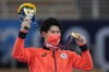 FILE - In this July 28, 2021, file photo, Daiki Hashimoto, of Japan, poses with his gold medal for the artistic gymnastics men's all-around final at the 2020 Summer Olympics in Tokyo. Despite the pandemic, the one-year delay and the soaring costs, the Japanese public may still find a sweet spot for these Olympics, the way it did for the storied 1964 Games. Why? A historic haul of medals. Japan had its best Olympics in every category: the most gold medals (27), the most overall (58), and a third-place finish in both categories behind two much larger countries - the United States and China. (AP Photo/Natacha Pisarenko, File)