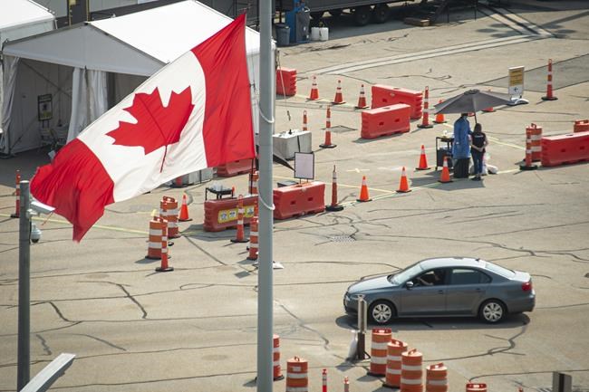 Car cross the border into Canada, in Niagara Falls, Ont., on Monday, August 9, 2021. American citizens and permanent residents are now allowed to enter Canada for non-essential purposes if they can provide proof that they’ve been fully vaccinated for at least 14 days.THE CANADIAN PRESS/Eduardo Lima