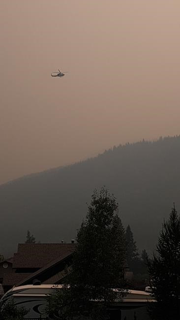 A helicopter is shown near the White Rock Lake wildfire near Westwold, B.C., in this recent handout photo. THE CANADIAN PRESS/HO - Brenda Geisbrecht
