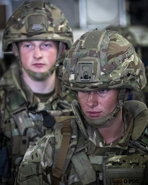 In this photo provided by the Ministry of Defence on Sunday, Aug. 15, 2021, members of the 16 Air Assault Brigade arrive in Kabul as part of a 600-strong UK-force sent to assist with Operation PITTING to rescue British nationals in Afghanistan amidst the worsening security situation there. (Leading Hand Ben Shread/Ministry of Defence via AP)