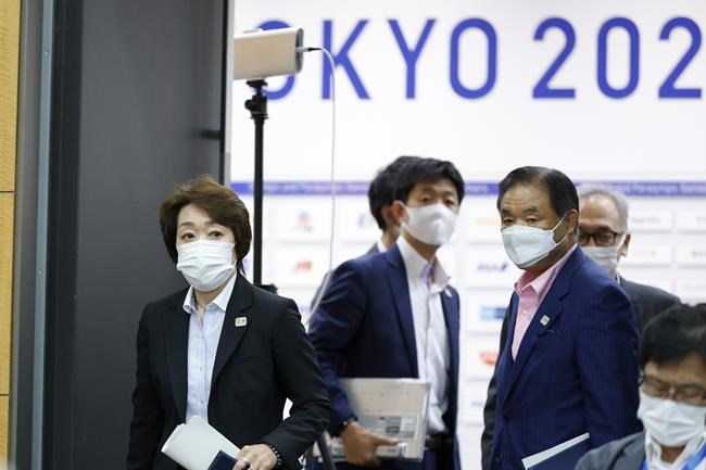Seiko Hashimoto President of Tokyo 2020, left, attends a four-party meeting in Tokyo, Monday, Aug. 16, 2021. All fans will be barred from the Paralympics during the pandemic, just as they were from the recently-completed Tokyo Olympics, organizers said Monday. (Rodrigo Reyes Marin/Pool Photo via AP)