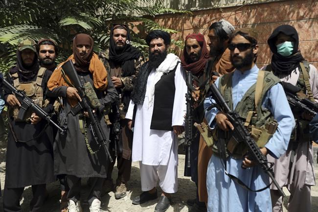 Taliban fighters pose for photograph in Wazir Akbar Khan in the city of Kabul, Afghanistan, Wednesday, Aug. 18, 2021. The Taliban declared an