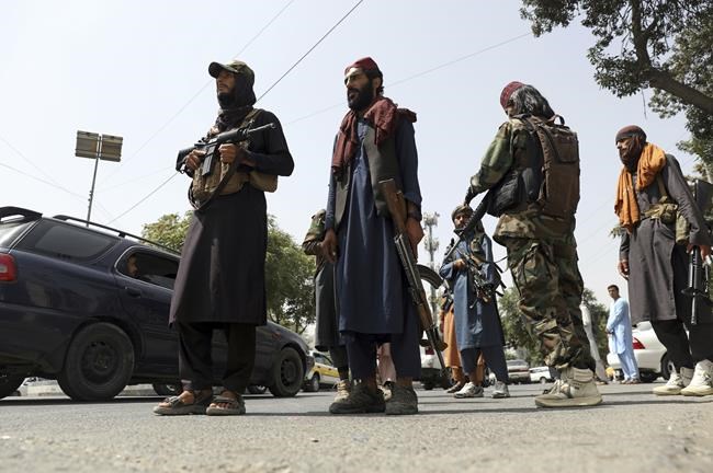 Taliban fighters patrol in Wazir Akbar Khan neighborhood in the city of Kabul, Afghanistan, Wednesday, Aug. 18, 2021. The Taliban declared an