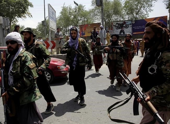 Taliban fighters patrol in Kabul, Afghanistan, Thursday, Aug. 19, 2021. The Taliban celebrated Afghanistan's Independence Day on Thursday by declaring they beat the United States, but challenges to their rule ranging from running a country severely short on cash and bureaucrats to potentially facing an armed opposition began to emerge. (AP Photo/Rahmat Gul)
