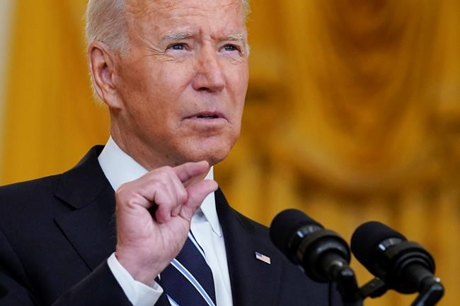 President Joe Biden speaks from the East Room of the White House in Washington, Wednesday, Aug 18, 2021, on the COVID-19 response and vaccination program. U.S. health officials Wednesday announced plans to offer COVID-19 booster shots to all Americans to shore up their protection amid the surging delta variant and signs that the vaccines' effectiveness is falling. (AP Photo/Susan Walsh)