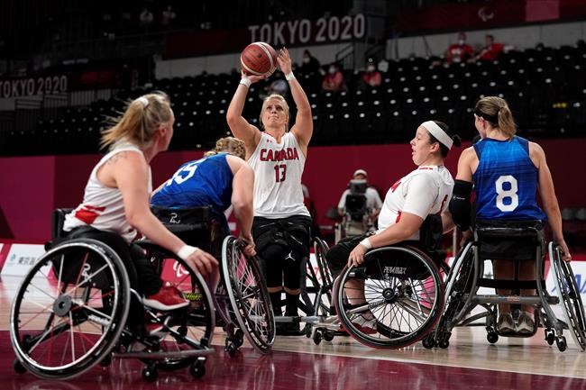 Canada's Kathleen Dandeneau (13) shoots during a women's wheelchair basketball quarterfinal game against the United States at the Tokyo 2020 Paralympic Games, Tuesday, Aug. 31, 2021, in Tokyo, Japan. THE CANADIAN PRESS/AP-Kiichiro Sato