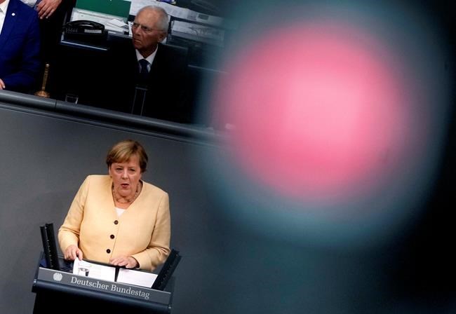 German Chancellor Angela Merkel speaks during a debate about the situation in Germany ahead of the upcoming national election in Berlin, Germany, Tuesday, Sept. 7, 2021. National elections are scheduled in Germany for Sept. 26, 2021. (AP Photo/Markus Schreiber)