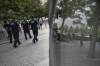 NYPD officer Michael Dougherty, a 25-year veteran, patrols with his colleagues at the National September 11 Memorial & Museum where names of his deceased colleagues and friends are displayed, Monday, Aug. 16, 2021, in New York. 
