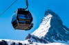 FILE - In this Wednesday, March 18, 2020 file photo, a view of a 'Matterhorn-Express' gondola lift in front of Matterhorn mountain in the Zermatt ski resort, in Zermatt, Switzerland. A downhill race starting in Switzerland and ending in Italy will be added to Alpine skiing’s World Cup program as soon as next year, it was announced Friday, Oct. 1, 2021. The International Ski Federation has confirmed the plan. Men’s and women’s races beneath the iconic Matterhorn mountain near upscale Zermatt are likely in November 2022. (Jean-Christophe Bott/Keystone via AP, File)