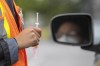 A person waits to receive their COVID-19 vaccine during a drive-thru clinic at Richardson stadium in Kingston, Ont., Friday, July 2, 2021. Canada is facing a potential wave of terminations tied to mandatory workplace vaccine policies as a growing number of employers require workers to be fully inoculated against COVID-19 -- or risk losing their jobs, legal experts say. THE CANADIAN PRESS/Lars Hagberg