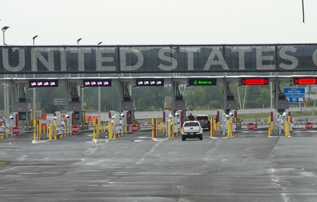 A car heads to the U.S. border crossing, Monday, August 9, 2021 in Lacolle, Que., south of Montreal. THE CANADIAN PRESS/Ryan Remiorz