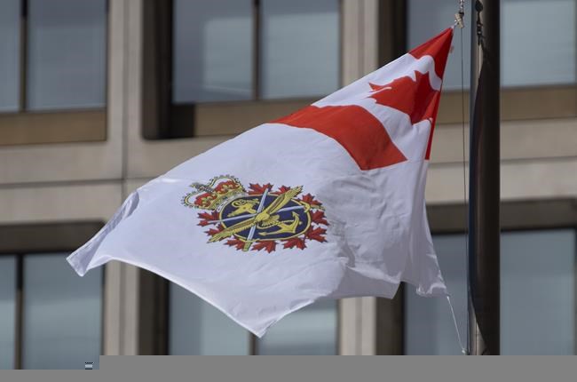 The Canadian Forces flag flies outside office buildings in Ottawa, Tuesday March 9, 2021. Military police say they are investigating “historic” allegations of sexual misconduct involving yet another senior commander, this time the officer responsible for human resources in the Canadian Armed Forces. THE CANADIAN PRESS/Adrian Wyld