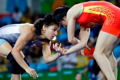 Canada's Jasmine Mian, blue, competes against China's Sun Yanan during the women's 48-kg freestyle wrestling competition at the 2016 Summer Olympics in Rio de Janeiro, Brazil, Wednesday, Aug. 17, 2016. Newly elected Calgary city councillor Jasmine Mian joins several Olympic and Paralympic athletes who have run for political office in Canada and won in recent years. THE CANADIAN PRESS/AP, Markus Schreiber