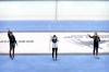 From left, silver medalist Courtney Sarault of Canada, gold medalist Lee Yu-bin of South Korea, and bronze medalist Kristen Santos of the United States wave during the medal ceremony for women's 1500m at the ISU World Cup Short Track speed skating competition, a test event for the 2022 Winter Olympics, at the Capital Indoor Stadium in Beijing, Saturday, Oct. 23, 2021. THE CANADIAN PRESS/AP-Mark Schiefelbein