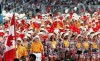 Canadian athletes, lead by flag bearer decathlete Mike Smith, parade onto the field at Olympic stadium in Barcelona on July 25, 1992. 