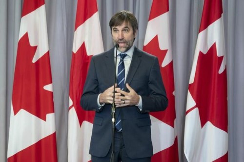 Minister of Environment and Climate Change Steven Guilbeault speaks with the media following a cabinet meeting, in Ottawa, Wednesday, Oct. 27, 2021. THE CANADIAN PRESS/Adrian Wyld