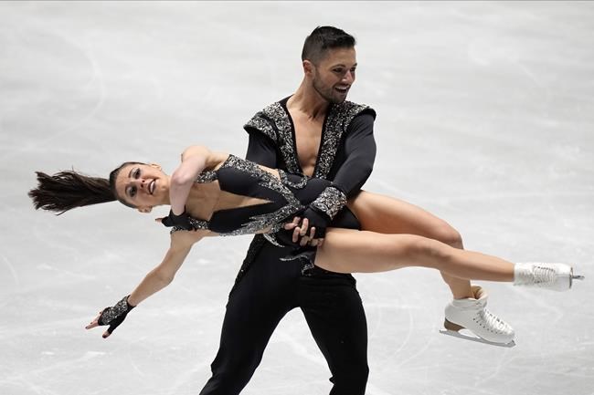 Lilah Fear and Lewis Gibson of Britain perform during the Ice Dance Rhythm Dance at the ISU Grand Prix of Figure Skating NHK Trophy competition in Tokyo, Japan, Friday, Nov. 12, 2021. (AP Photo/Shuji Kajiyama)