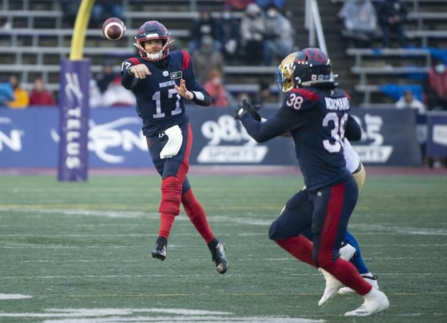 Montreal Alouettes quarterback Trevor Harris (17) throws a pass towards teammate Christophe Normand during second half CFL football action against the Winnipeg Blue Bombers, in Montreal, Saturday, Nov. 13, 2021. THE CANADIAN PRESS/Graham Hughes