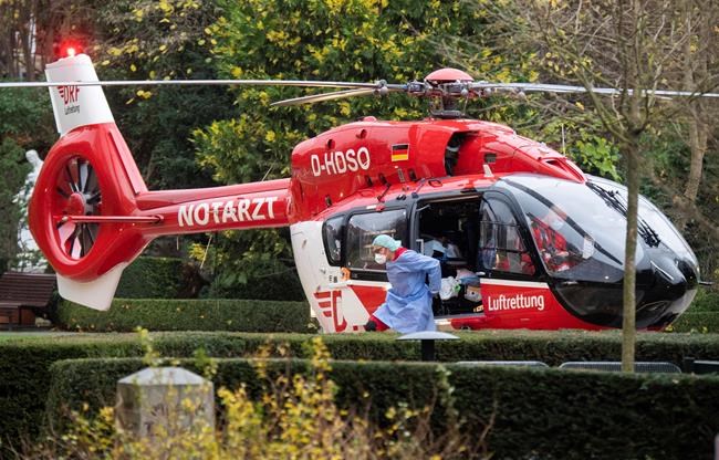 A helicopter of the DRF Luftrettung brings a patient who is seriously ill with the coronavirus and the COVID-19 disease to the St. Bernward Hospital in Hildesheim, Germany, Friday, Nov. 26, 2021. From Bavaria, Thuringia and Saxony, Covid-19 patients are transport to hospitals in the north and west of Germany. (Julian Stratenschulte/dpa via AP)