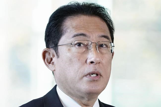 Japanese Prime Minister Fumio Kishida speaks to reporters at his official residence in Tokyo Monday, Nov. 29, 2021. Kishida said Monday that Japan is considering stepping up border controls as a new variant of the coronavirus found in South Africa spreads around the world. (Kyodo News via AP)
