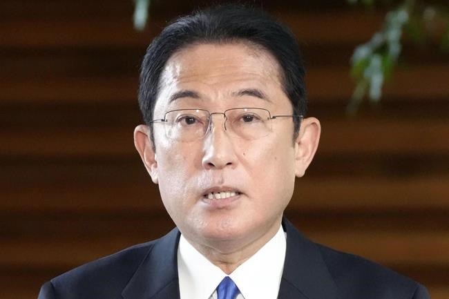 Japan's Prime Minister Fumio Kishida answers to reporters' questions about a measure against the new omicron variant of the coronavirus, at his official residence in Tokyo Monday, Nov. 29, 2021. Japan announced Monday it will suspend entry of all foreign visitors from around the world as a new coronavirus variant spreads. (Sadayuki Goto/Kyodo News via AP)