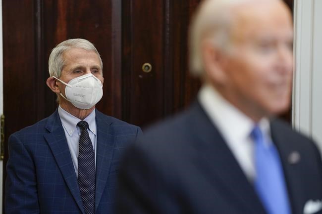 President Joe Biden speaks about the COVID-19 variant named omicron, in the Roosevelt Room of the White House, Monday, Nov. 29, 2021, in Washington, as Dr. Anthony Fauci, director of the National Institute of Allergy and Infectious Diseases listens. (AP Photo/Evan Vucci)