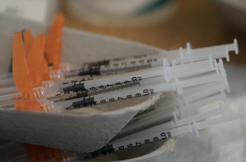 Needles are seen filled with the vaccination for COVID-19 at a truck stop along highway 91 North in Delta, B.C., on June 16, 2021. THE CANADIAN PRESS/Jonathan Hayward