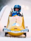 Francesco Friedrich and Alexander Schueller from Germany cross the finish line after winning the two-man-world cup in Altenberg, Germany, Saturday, Dec. 4, 2021. (Robert Michael/dpa via AP)