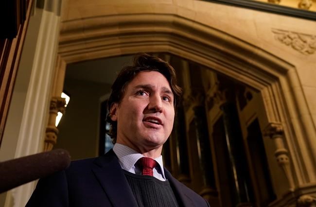 Prime Minister Justin Trudeau speaks with the media as he makes his way to caucus, Wednesday, December 8, 2021 in Ottawa. Trudeau says Canada will not sendany diplomats to the Beijing Olympics. He says the country is