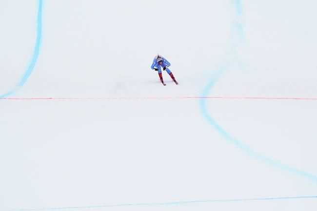 Italy's Sofia Goggia crosses the finish line of an alpine ski, women's World Cup super-G in St. Moritz, Switzerland, Saturday, Dec. 11, 2021. (AP Photo/Pier Marco Tacca)