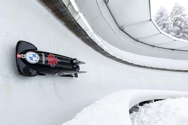 Cynthia Appiah and Dawn Richardson Wilson from Canada speed down the track during the women's two-women bobsleigh World Cup race in Igls, near Innsbruck, Austria, Sunday, Nov. 28, 2021. Canada won bronze in the monobob and four-man races Saturday at the Winterberg World Cup bobsled competition. THE CANADIAN PRESS/AP-Lisa Leutner