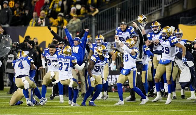 The Winnipeg Blue Bombers celebrate their victory against the Hamilton Tiger-Cats in the 108th CFL Grey Cup in Hamilton, Ont., on Sunday, December 12, 2021. THE CANADIAN PRESS/Ryan Remiorz