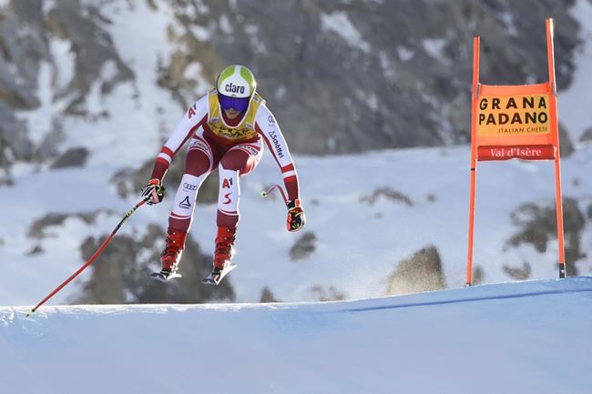 Austria's Mirjam Puchner speeds down the course during an alpine ski, women's World Cup downhill race, in Val D'Isere, France, Saturday, Dec. 18, 2021. (AP Photo/Marco Trovati)