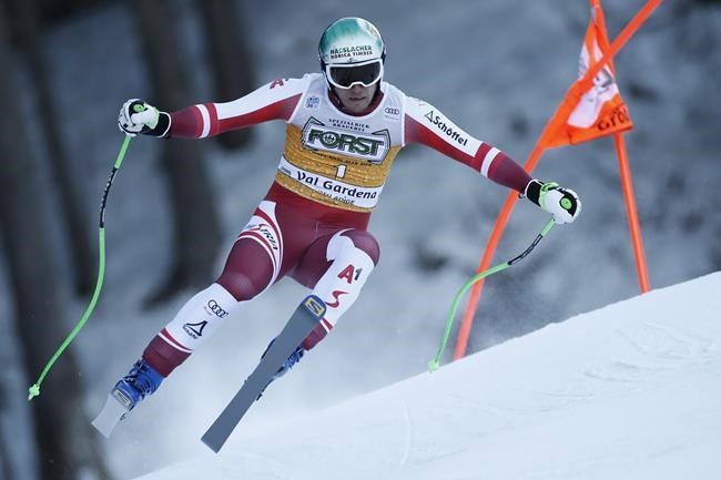 Austria's Otmar Striedinger speeds down the course during an alpine ski, men's World Cup downhill race, in Val Gardena, Italy, Saturday, Dec.18, 2021. (AP Photo/Gabriele Facciotti)