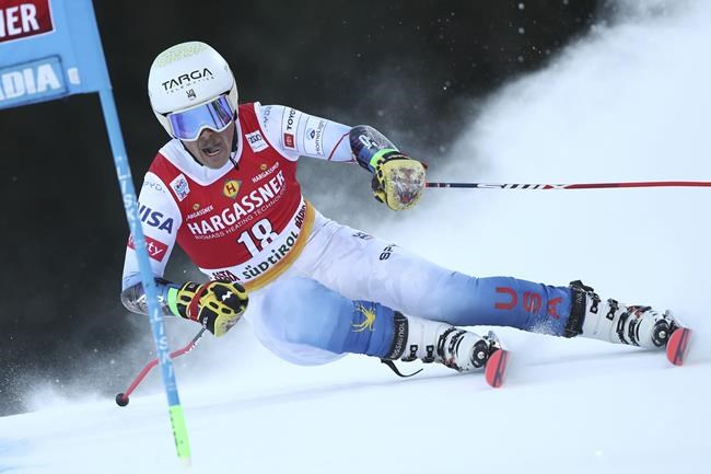 United States' River Radamus speeds down the course during an alpine ski, men's World Cup giant slalom, in Alta Badia, Italy, Sunday, Dec.19, 2021. (AP Photo/Gabriele Facciotti)