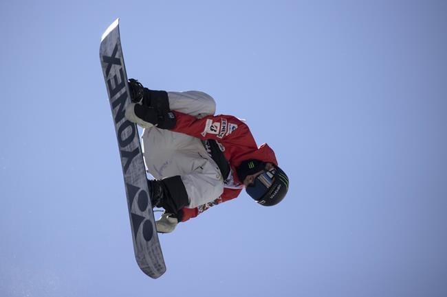 Yuto Totsuka, of Japan, executes a trick in the snowboarding halfpipe finals, Sunday, Dec. 19, 2021, during the Dew Tour at Copper Mountain, Colo. (AP Photo/Hugh Carey)