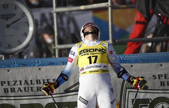 United States' River Radamus reacts at finish area after completing an alpine ski, men's World Cup giant slalom race in Alta Badia, Italy, Monday, Dec. 20, 2021. (AP Photo/Gabriele Facciotti)