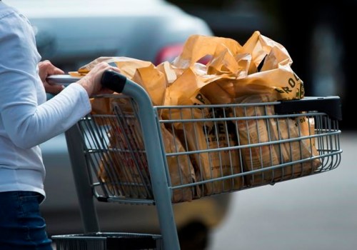 A woman leaves a grocery store using plastic bags in Mississauga, Ont., on Thursday, August 15, 2019.&nbsp;It's the end of days for plastic grocery bags and Styrofoam take-out containers in Canada.THE CANADIAN PRESS/Nathan Denette