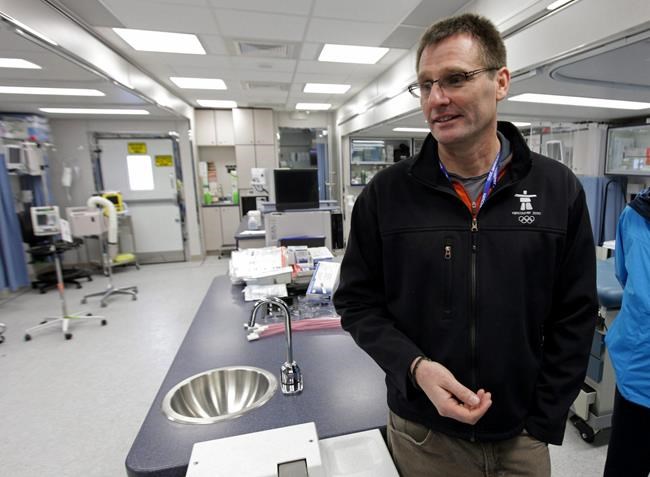 Dr. Mike Wilkinson speaks to reporters in a mobile medical unit setup at the Whistler Athletes' Village for the Vancouver 2010 Winter Olympic Games in Whistler, B.C., on Wednesday January 20, 2010. THE CANADIAN PRESS/Darryl Dyck
