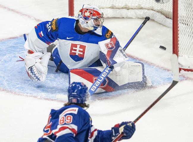 United States' Matthew Knies (89) scores on Slovakia goaltender Simon Latkoczy (30) during first period IIHF World Junior Hockey Championship action in Red Deer, Alberta on Sunday, December 26, 2021. THE CANADIAN PRESS/Jonathan Hayward
