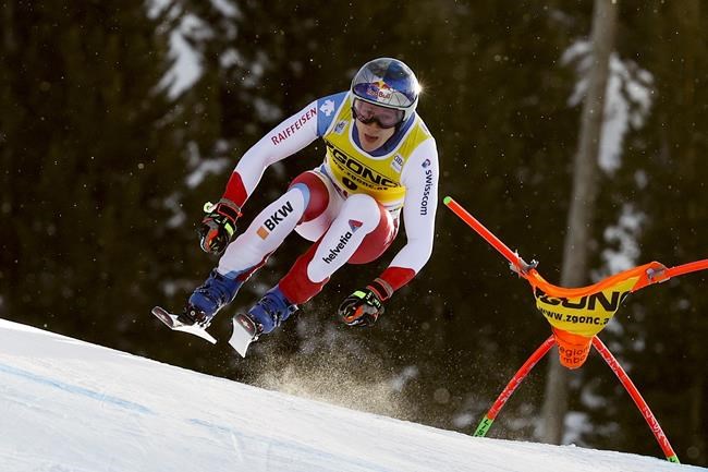 Switzerland's Marco Odermatt speeds down the course during an alpine ski, men's World Cup downhill race, in Bormio, Italy, Tuesday, Dec. 28, 2021. (AP Photo/Luciano Bisi)