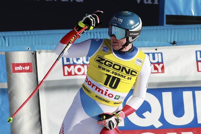 Switzerland's Niels Hintermann celebrates at the finish area of an alpine ski, men's World Cup downhill race, in Bormio, Italy, Tuesday, Dec. 28, 2021. (AP Photo/Felice Calabro)