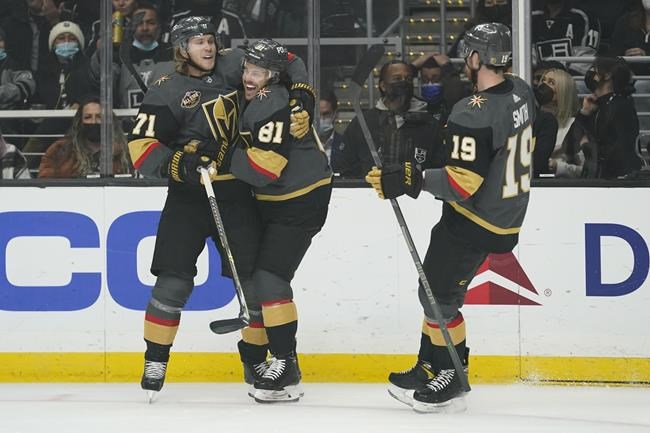Vegas Golden Knights center Jonathan Marchessault (81) celebrates with center William Karlsson (71) after scoring during the first period of the team's NHL hockey game against the Los Angeles Kings on Tuesday, Dec. 28, 2021, in Los Angeles. (AP Photo/Ashley Landis)