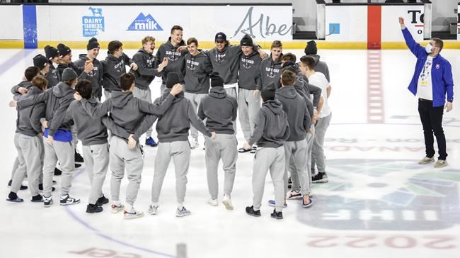 Players from the Slovakian team gather at centre ice after the IIHF World Junior Hockey Championship was cancelled in Red Deer, Alberta on Wednesday, Dec. 29, 2021.THE CANADIAN PRESS/Jeff McIntosh