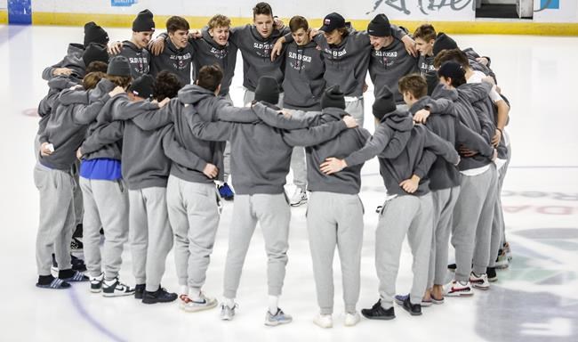 Players from the Slovakian team gather at centre ice after the IIHF World Junior Hockey Championship was cancelled in Red Deer, Alberta on Wednesday, Dec. 29, 2021.THE CANADIAN PRESS/Jeff McIntosh