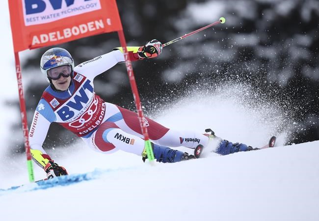 Switzerland's Marco Odermatt speeds down the course during an alpine ski, men's World Cup Giant slalom, in Adelboden, Switzerland, Saturday, Jan. 8, 2022. (AP Photo/Gabriele Facciotti)