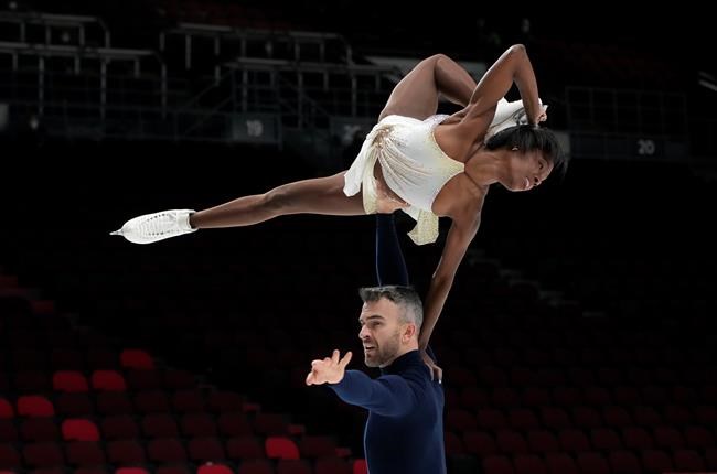 Vanessa James and Eric Radford perform their routine during the senior pairs short program at the National Skating Championships in Ottawa, Friday, Jan. 7, 2022. James and Radford withdrew from the pairs competition at the Canadian figure skating championships before Saturday's free program. THE CANADIAN PRESS/Adrian Wyld